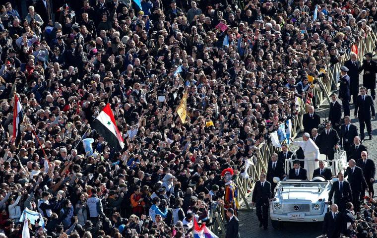 Pope Francis waves to the crowd from the papamobile during his inauguration mass in St. Peter's square, Vatican City, March 19. Hundreds of thousands of faithful, as well as political and religious dignitaries from all over the world, were expected to attend the inauguration mass of Pope Francis.