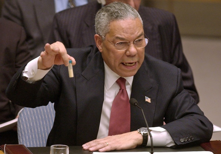 U.S. Secretary of State Colin Powell holds up a vial that he said could contain anthrax as he presents evidence of Iraq's alleged weapons programs to the United Nations Security Council on Feb. 5, 2003.