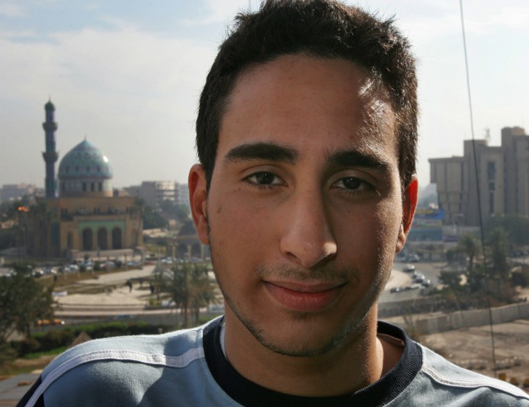 Farris Hassan, a 16-year-old-teen from Fort Lauderdale. Fla., poses for a portrait at a hotel, backdropped by the Ramadan 14th mosque in Baghdad, Iraq, on Dec. 28, 2005.
