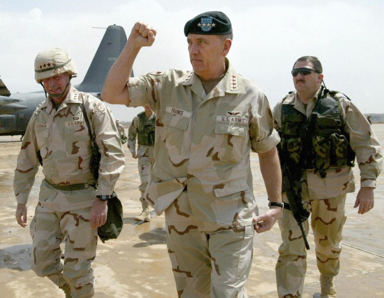 U.S. Gen.Tommy Franks pumpa his fist upon arrival at the newly re-named Baghdad International Airport April 16, 2003.