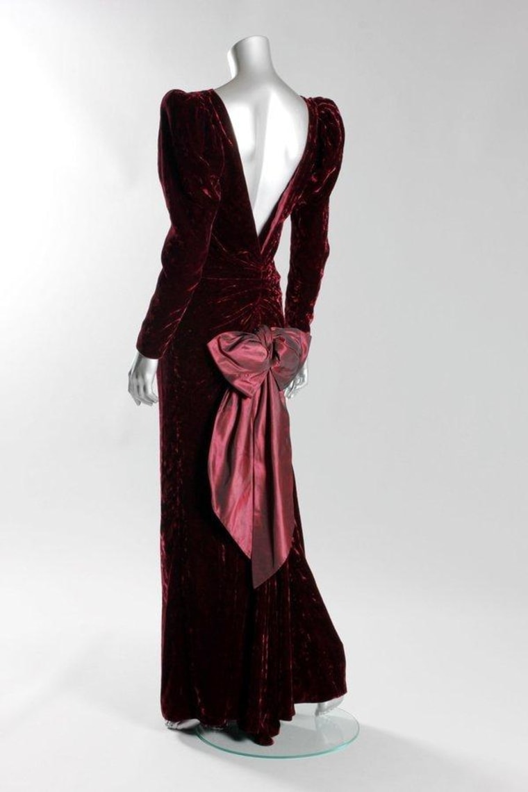 Princess Diana wore this Catherine Walker burgundy crushed velvet evening gown during a state visit to Australia and to the film premiere of \"Back to the Future\" in 1985. It sold at auction for $163,000.
