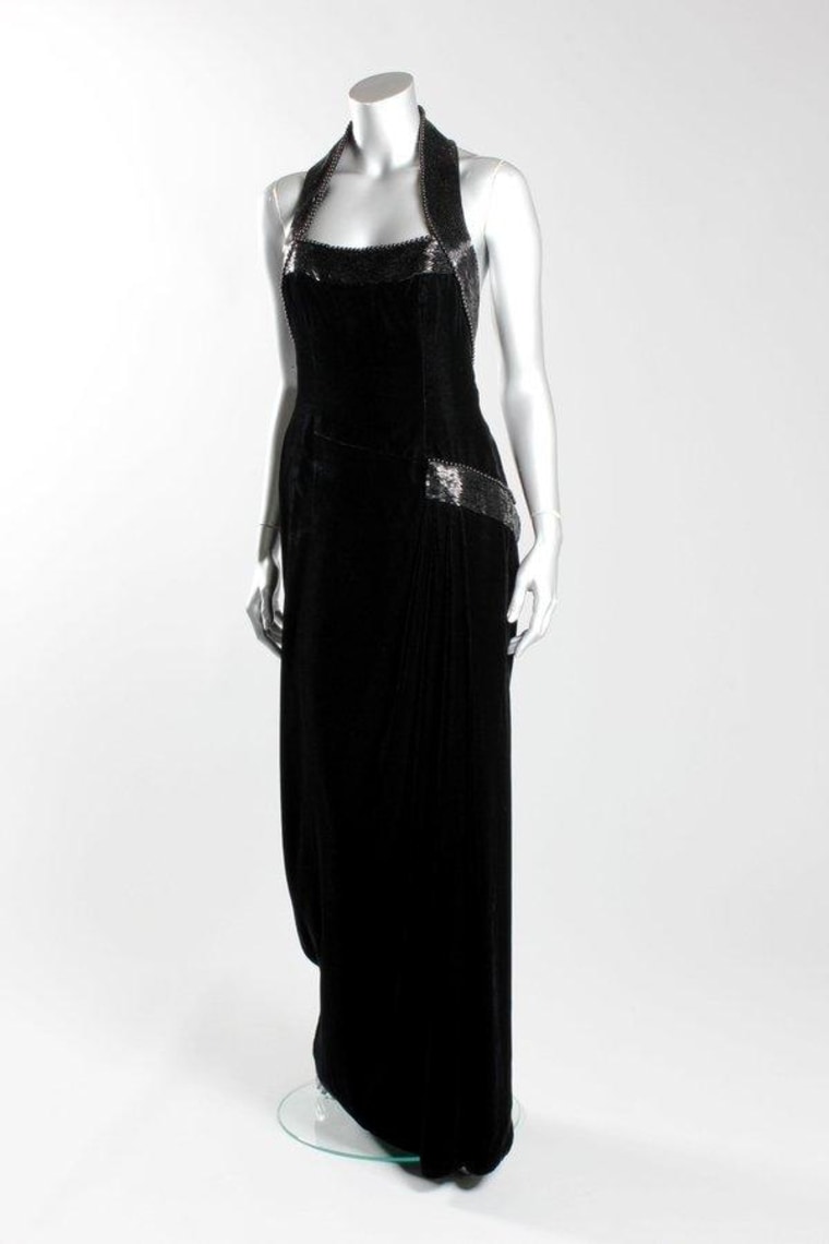 Diana wore this Catherine Walker black velvet and beaded evening gown for the Vanity Fair photo-shoot at Kensington Palace in 1997. It sold Tuesday for $163,000.