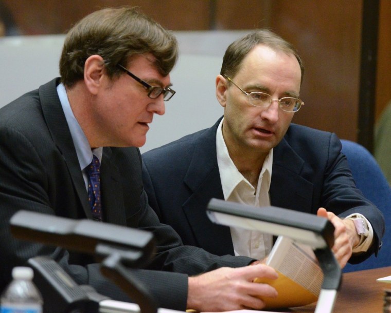 Defendant Christian Gerhartsreiter from Germany (R) speaks with his attorney Brad Bailey during his murder trial at Los Angeles Superior Court on March 18, 2013 in Los Angeles, California. Gerhartsreiter, the alleged Rockefeller impostor, is accused of killing his landllord, John Sohus in February 1985.