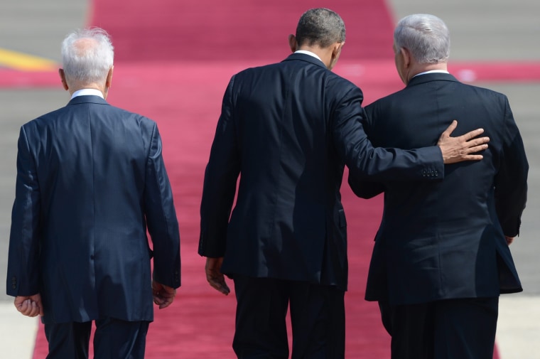 Left to right, Israeli President Shimon Peres, President Barack Obama, and Israeli Prime Minister Benjamin Netanyahu stand during the welcoming ceremony at Ben Gurion airport, Tel Aviv, on March 20. Air Force One touched down at Tel Aviv's Ben Gurion Airport, marking the start of Obama's first visit to Israel.