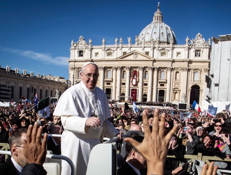 Pope Francis is driven through the crowd in in St. Peter's Square for his inaugural Mass at the Vatican on Tuesday, Mar. 19, 2013. Francis took his name from Francis of Assisi, who was known for his concern for the poor and downtrodden, and for a 13th century encounter with the Sultan of Egypt.