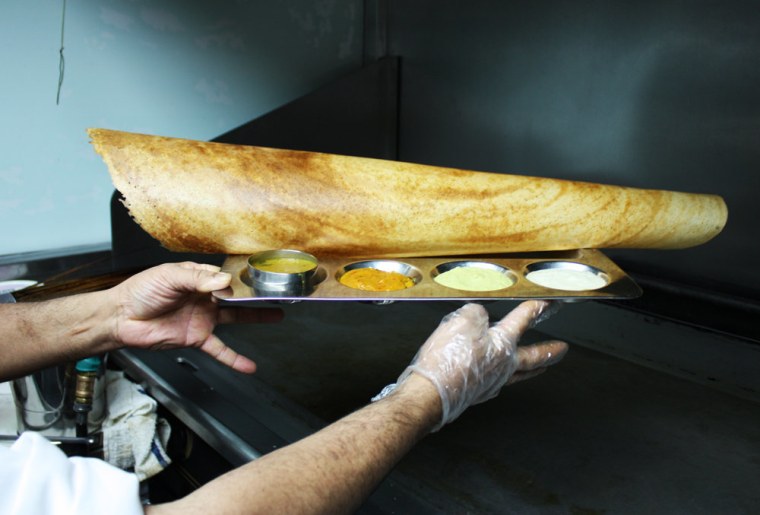 A finished dosa at Saravanaa Bhavan in New York City,