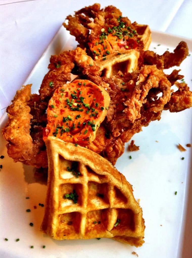 Whole fried soft-shell crab on top of a savory Old Bay-seasoned waffle served at Atwood Cafe in Chicago.