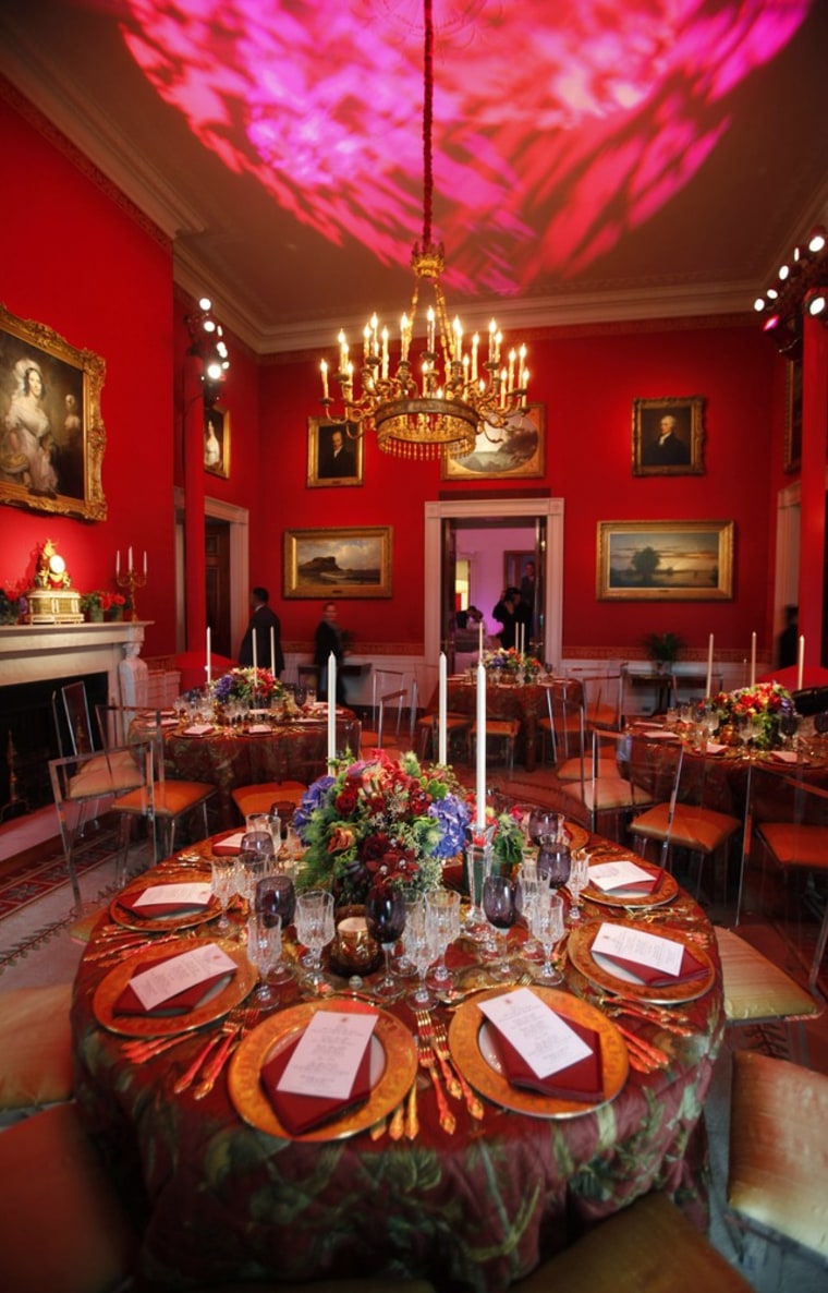 Table settings are shown in the Red Room of the White House for the state dinner hosted by U.S. President Barack Obama for Chinese President Hu Jintao in Washington on Jan. 20, 2011.