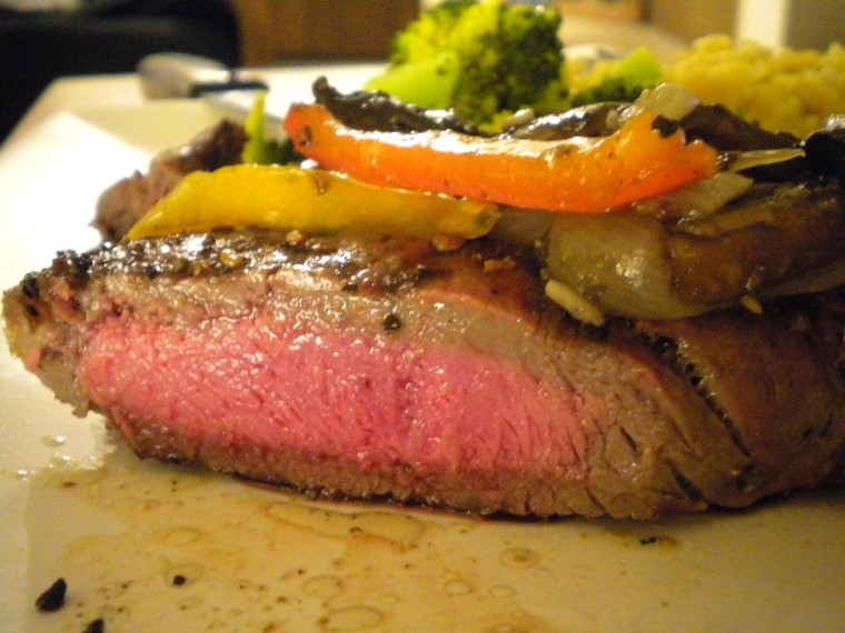New York Strip steak (perfect medium temp) with a medley of peppers, onion and mushrooms.