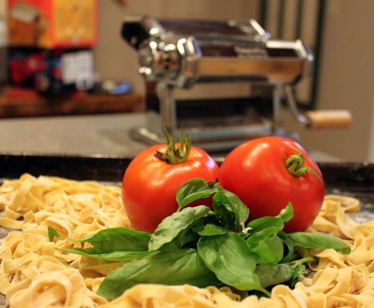 Homemade pasta with garden fresh tomatoes and basil