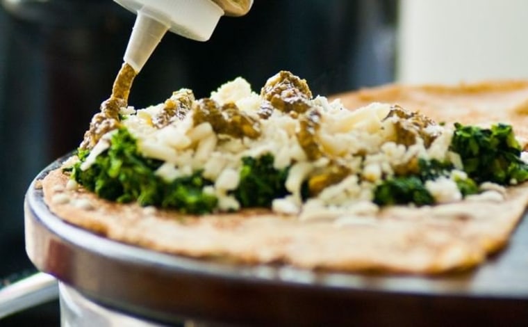 This was taken at the Chattanooga Market the place was called The Crepe Outdoors out of Cleveland, Tenn. It was their vegetarian crepe -- the pesto was amazing. The Crepe Outdoors does sweet and savory  -- everything looked so good.