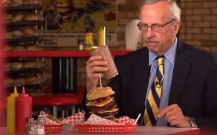 NBC's George Lewis prepares to try the 8,000-calorie burgers, fries and shake.
