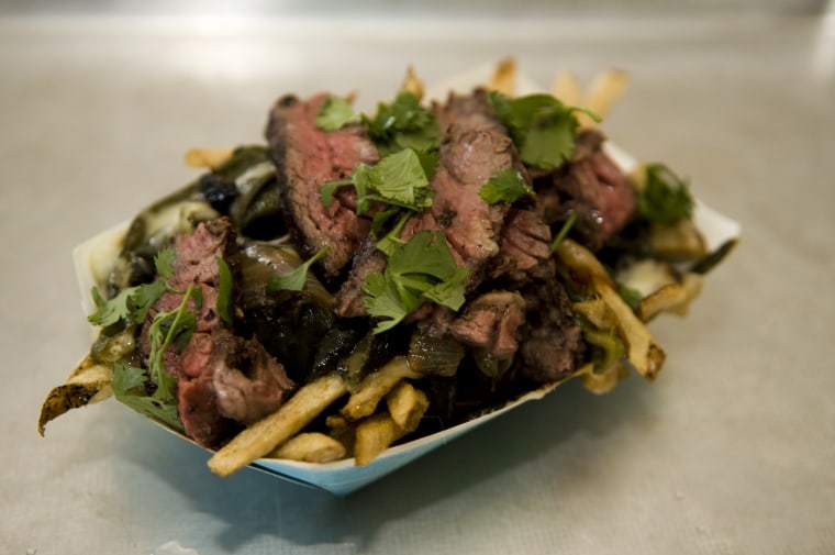 The Rajas Fries dish from Los Angeles Eatery Frysmith features fire-roasted poblano chiles, caramelized onions and schwarma-marinated steak with jack cheese.