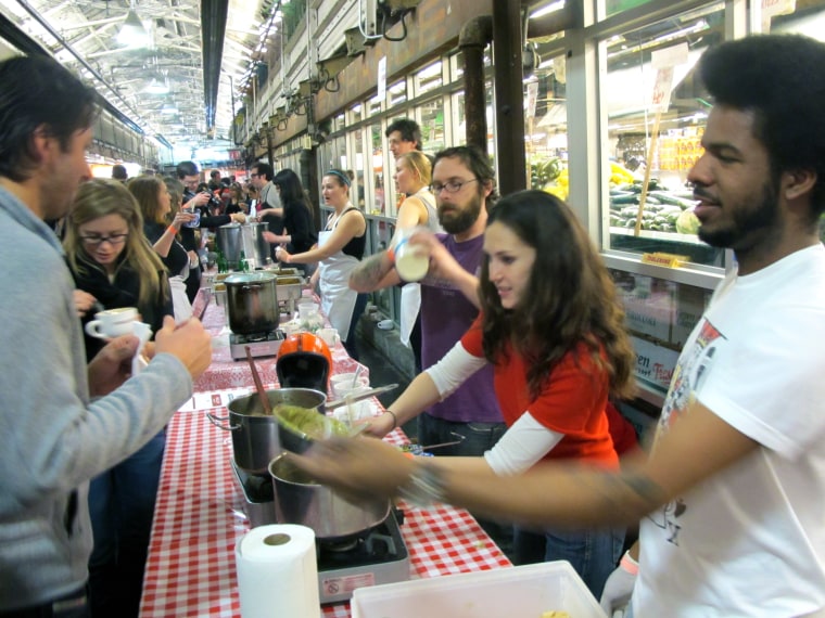 Chili-makers and tasters interact at NYChilifest 2011. In foreground is restaurant No.7's entry