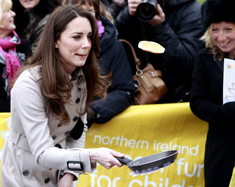Kate Middleton flips a pancake outside the city hall in Belfast, Northern Ireland, on Tuesday, also known an Pancake Day in the U.K.