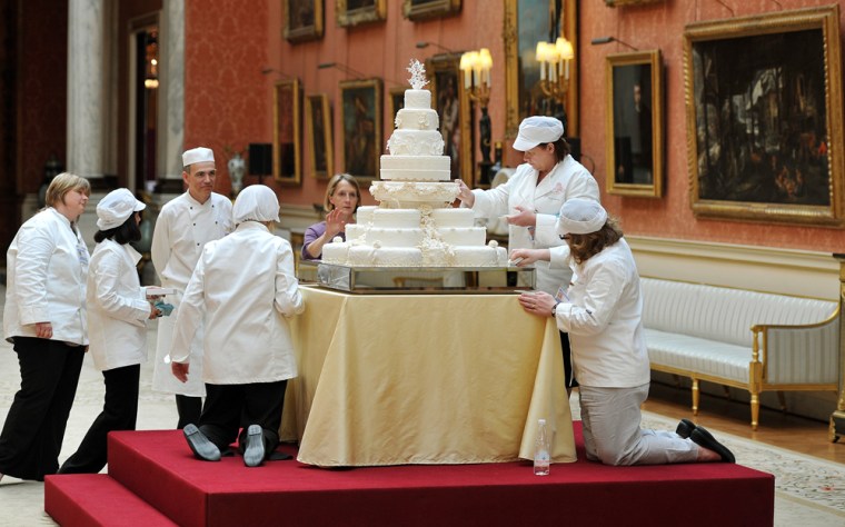 Bakers from Fiona Cairns Ltd of Leicestershire put the finishing touches on the royal fruitcake at the queen's luncheon reception.
