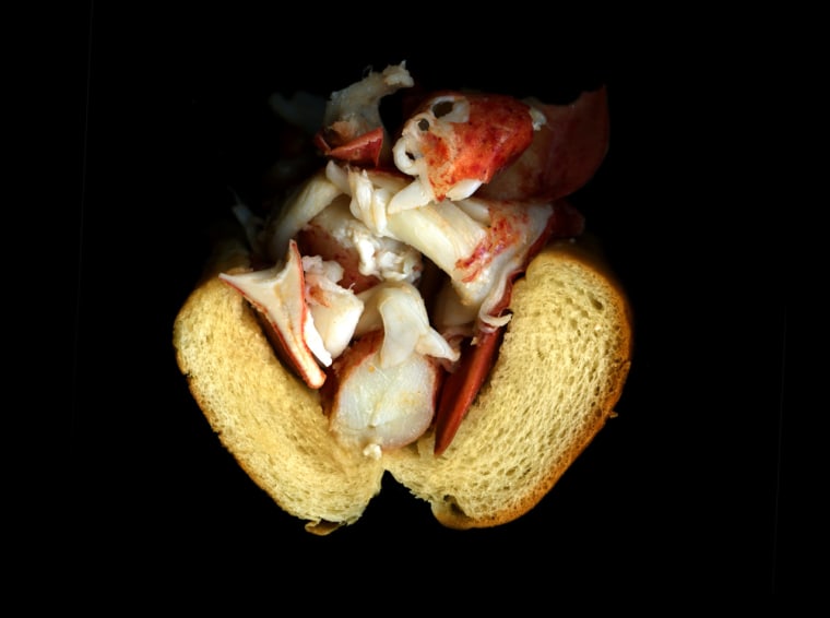 Hot steamed lobster, drawn butter, on a hot dog bun.