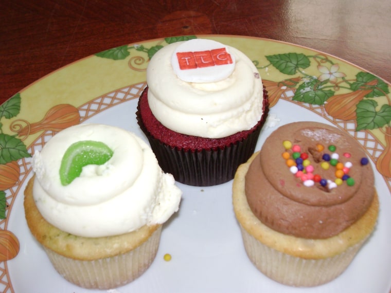 The sisters' best-seller is a red velvet cupcake with vanilla cream cheese frosting (center).