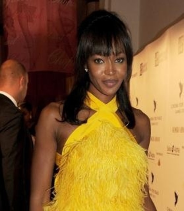 Naomi Campbell attends the Cinema For Peace inaugural Cannes dinner honoring Sean Penn for his charity work. (Getty)
