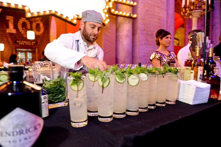 A bartender serves up the Snow Miser's Cooler, garnished with cucumbers.