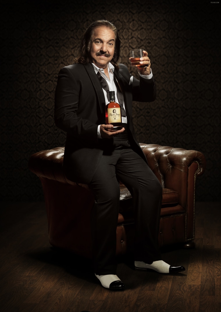 In this promo photo, Ron Jeremy poses with his rum, in a gentlemanly manner.