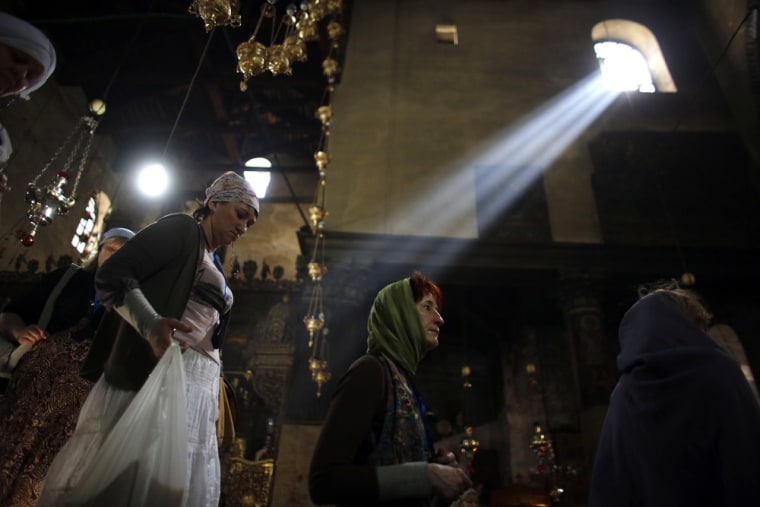 Christian worshipers visit the Church of the Nativity, revered as the site of Jesus' birth, in the Bethlehem on March 14. Despite the city's importance to Christianity, practitioners are a small minority there.