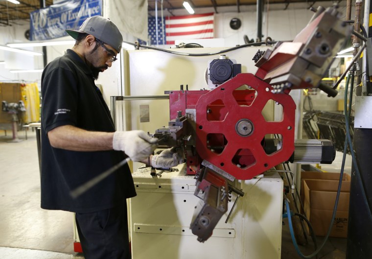 Thursday, Jan. 31, 2013, in Baltimore, MD (John Makely / NBC News) New employee Edrick Smith works on a wire bending machine. Drew Greenblatt , CEO...