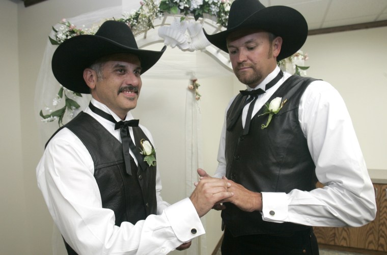 Jeff Barr, left, places a wedding ring on Wes Wilkinson at the Yolo County clerk's office in Woodland, Calif. on June 16, 2008. They were among the first gay couples to wed in Yolo County after the California Supreme Court overturned a ban on same-sex marriages.