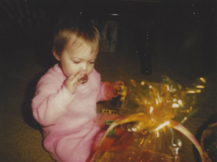 A very young Dylan Dreyer tastes some candy at Easter in 1983.