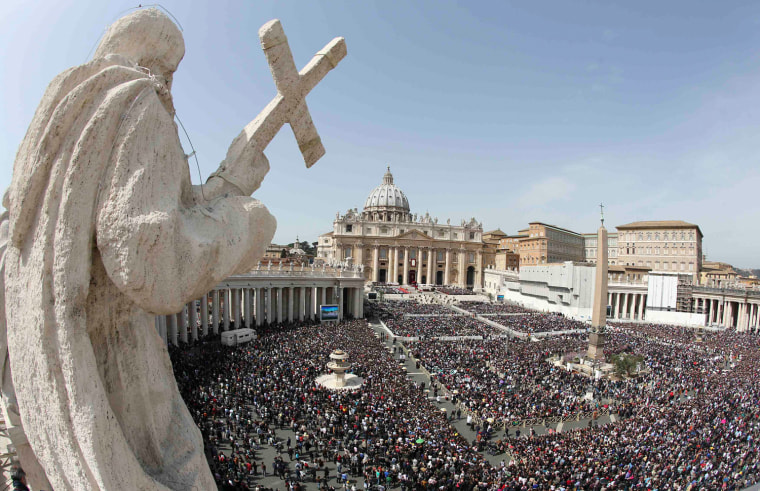 The faithful gather in St. Peter's Square for Pope Francis' Palm Sunday Mass at the Vatican.