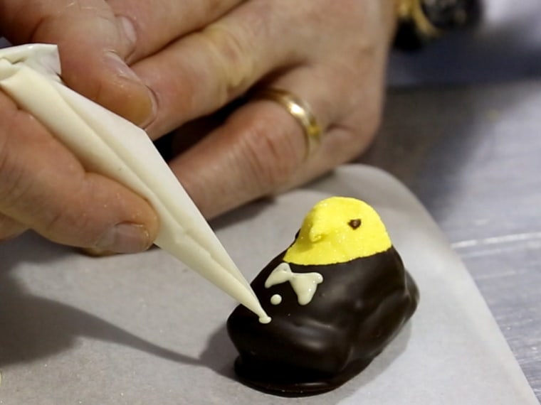 Torres uses white chocolate to make 'buttons' for his tuxedo-wearing Peeps.