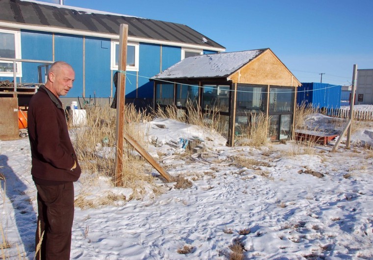 Kim Ernst, the Danish chef of Roklubben restaurant, which is nestled by a frozen lake near a former Cold War-era U.S. military base, looks over his greenhouse in Kangerlussaq on March 5, 2013.