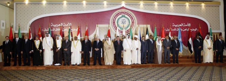 Heads of Arab states line up for a photo at the opening of the Arab League summit in Doha on Tuesday.