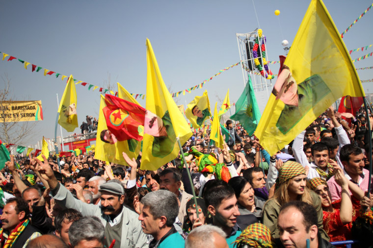 Flags with the face of imprisoned Kurdish leader Abdullah Ocalan dot the crowd at Newroz celebrations in Diyarbakir, Turkey, on Thursday.