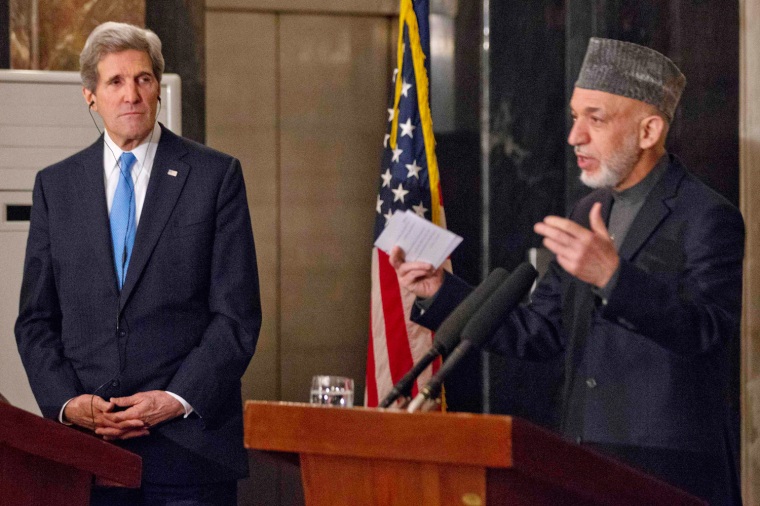 U.S. Secretary of State John Kerry, left, listens to Afghanistan's President Hamid Karzai during their joint news conference at the presidential palace in Kabul on Thursday, March 25, 2013.