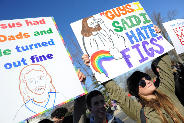 Same-sex marriage supporters demonstrate in front of the Supreme Court on March 27, in Washington, D.C.