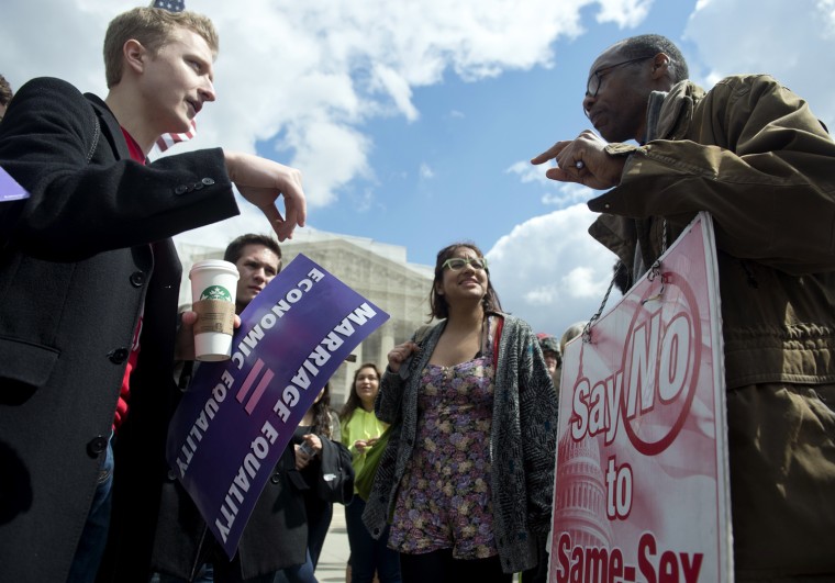 Same-sex marriage supporters and same-sex marriage opponents argue their points in front of the US Supreme Court on March 26, in Washington, D.C.