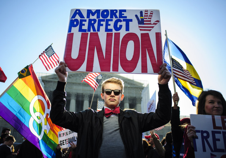 Pro same-sex marriage activist Ryan Toney, 18, of Washington, D.C. stands in front of the Supreme Court in Washington D.C. on Wednesday.
