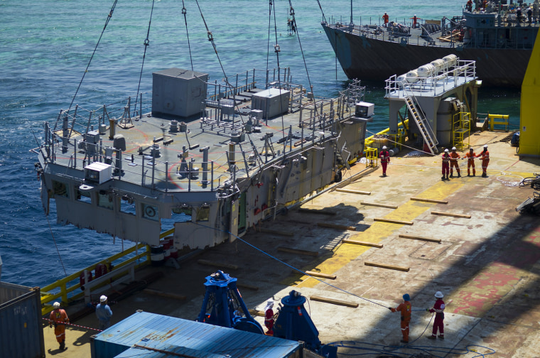 March 2: The second deck level is guided onto the U.S. Navy contracted vessel M/V Jascon 25.