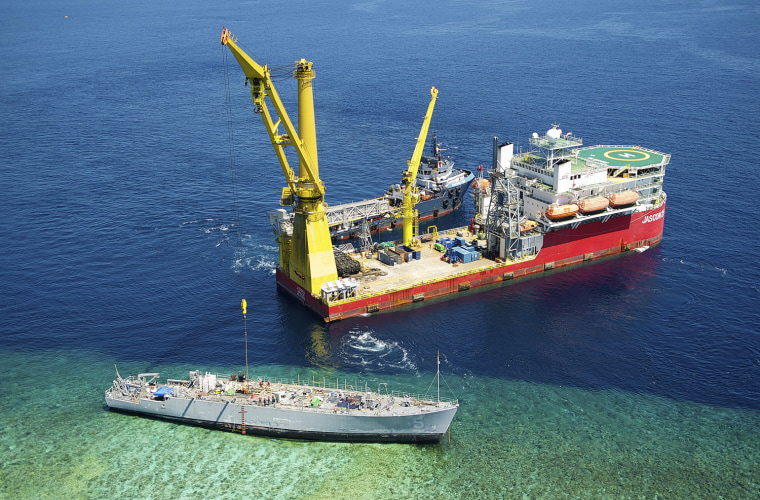 March 12: The M/V Jascon 25 and the tugboat Archon Tide are positioned next to the Guardian during salvage operations.