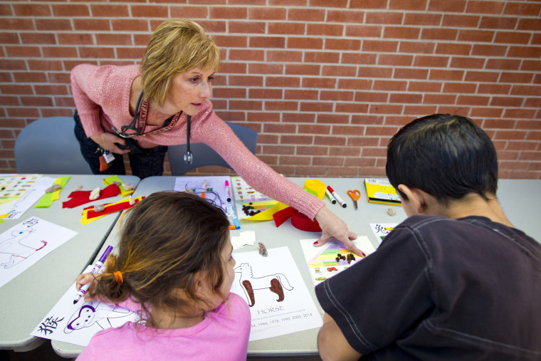 Nurse Karen Murphy uses a food pyramid bingo card to provide information about healthy eating.