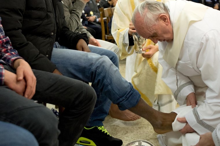 Pope Francis washes the feet of a young offender during a mass at the church of the Casal del Marmo youth prison on the outskirts of Rome as part of Holy Thursday. Pope Francis washed the feet of 12 young offenders including two girls at a Rome prison on Thursday. March 28, 2013, in an unprecedented version of an ancient Easter ritual seen as part of an effort by the new pope to bring the Catholic Church closer to the needy.