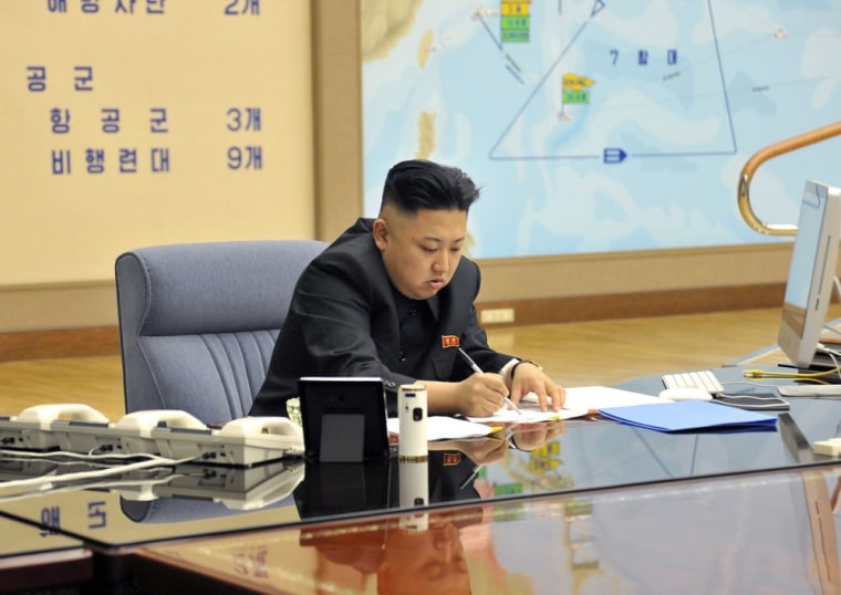 A picture released by the North Korean Central News Agency (KCNA) shows Kim Jong-un convening an urgent operation meeting at 0:30 am on March 29, 2013 at an undisclosed location, in which he ordered strategic rocket forces to be on standby to strike US and South Korean targets at any time.