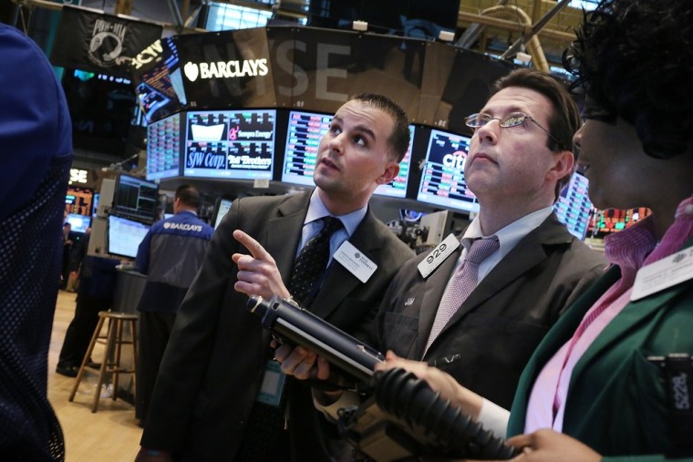 Things are looking up. Traders work on the floor of the New York Stock Exchange on March 28, 2013 when the S&P 500 finished at an all time high.