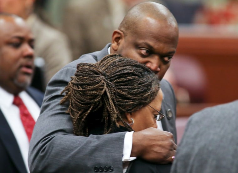 Nevada Assembly Majority Leader William Horne, D-Las Vegas, hugs Assemblywoman Dina Neal, D-North Las Vegas, following an emotional and historic vote to expel fellow Assemblyman Steven Brooks, D-North Las Vegas, during the Assembly floor session at the Legislative Building in Carson City, Nev., on March 27.