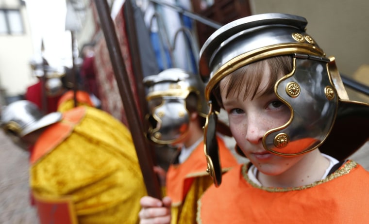 Members of the Italian community take part in a re-enactment of the crucifixion of Jesus Christ on Good Friday in Bensheim, southwest of Frankfurt March 29, 2013. Thousands of spectators watched the yearly Passion Play performed by about 100 laity actors. Holy Week is celebrated in many Christian traditions during the week before Easter.
