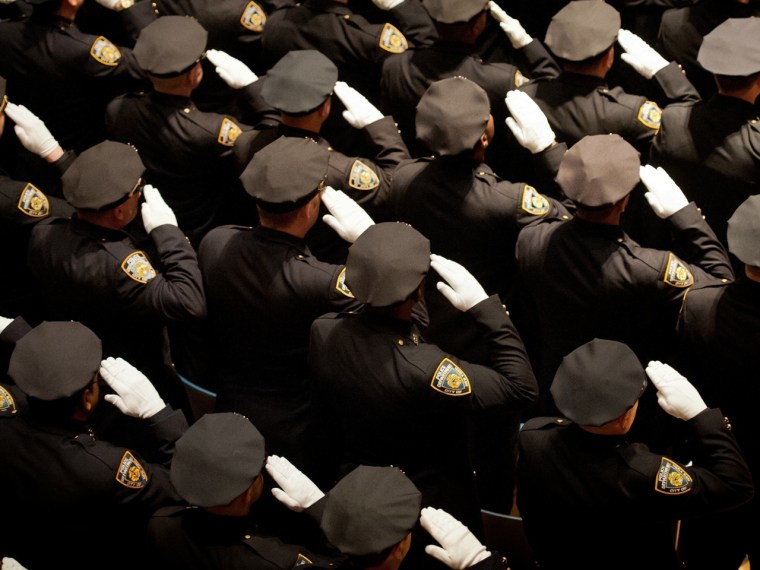 March 28, 2013 - Manhattan, New York, U.S. - Members of the Department salute during the presentation of colors at the City of New York Police Departm...