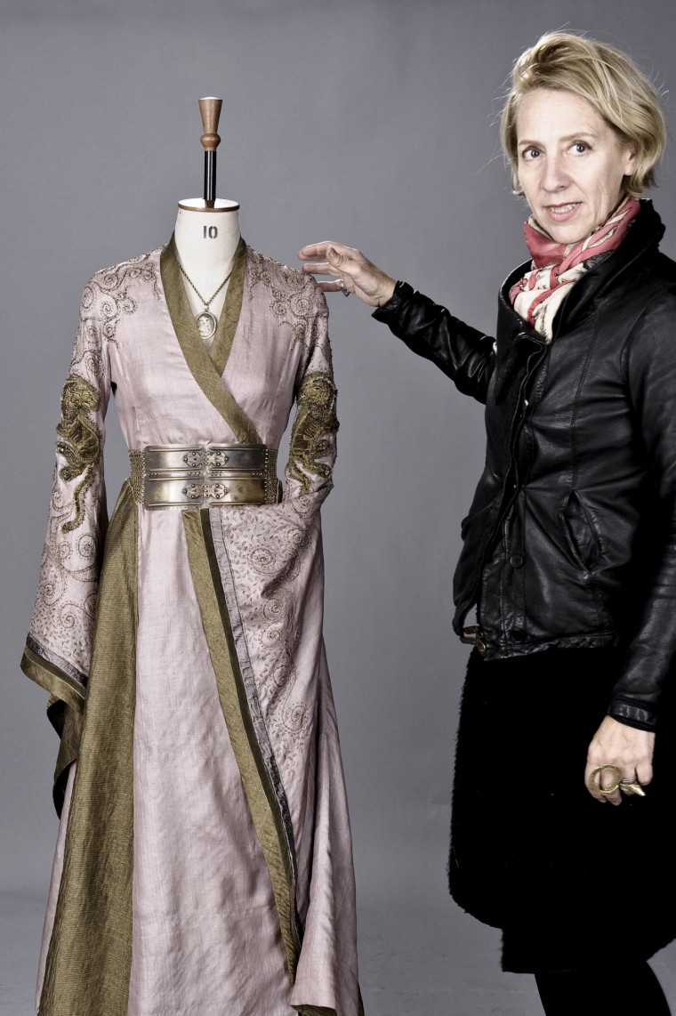 Costume designer Michele Clapton, posing with one of her designs, is responsible for the lavish wardrobes on HBO's \"Game of Thrones.\"