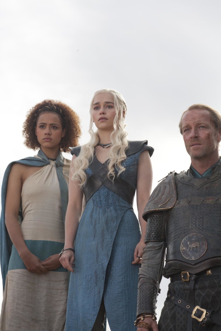 Nathalie Emmanuel, Emilia Clarke and Iain Glen pose together in season 3 of \"Games of Thrones\".