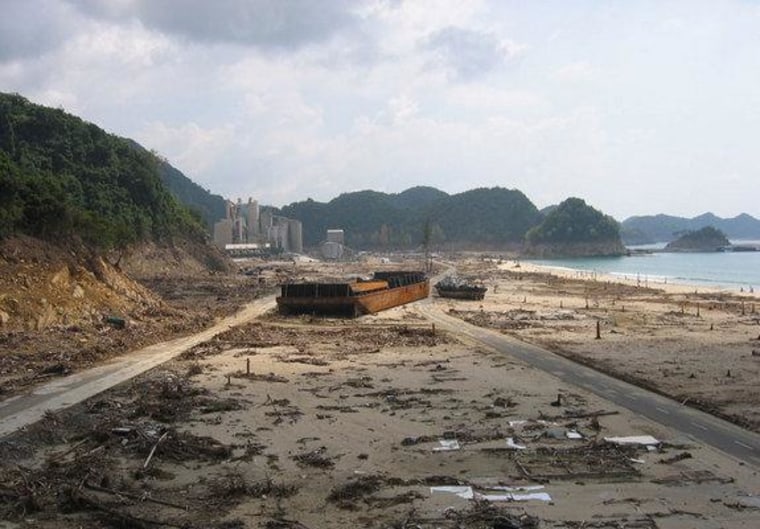 A coal barge and tug carried onto land in Lho Nga, Sumatra in 2004. The tsunami runup reached 104 feet (32 m) here.